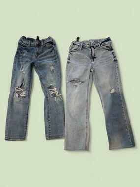 Pair of Distressed Light Blue Denim Jeans